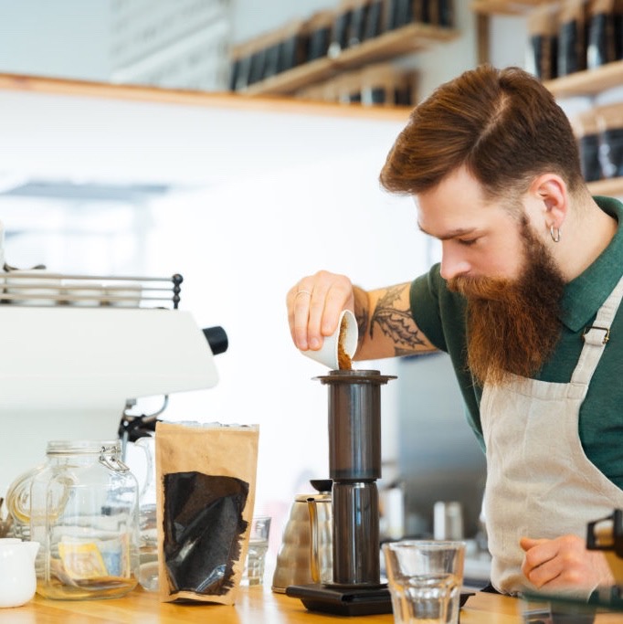 barista making coffee