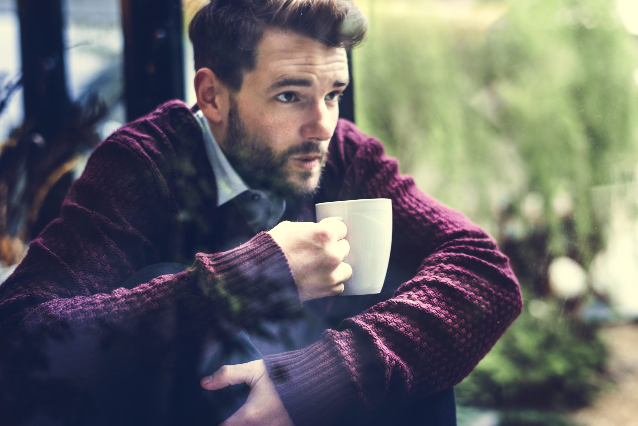 man sipping coffee